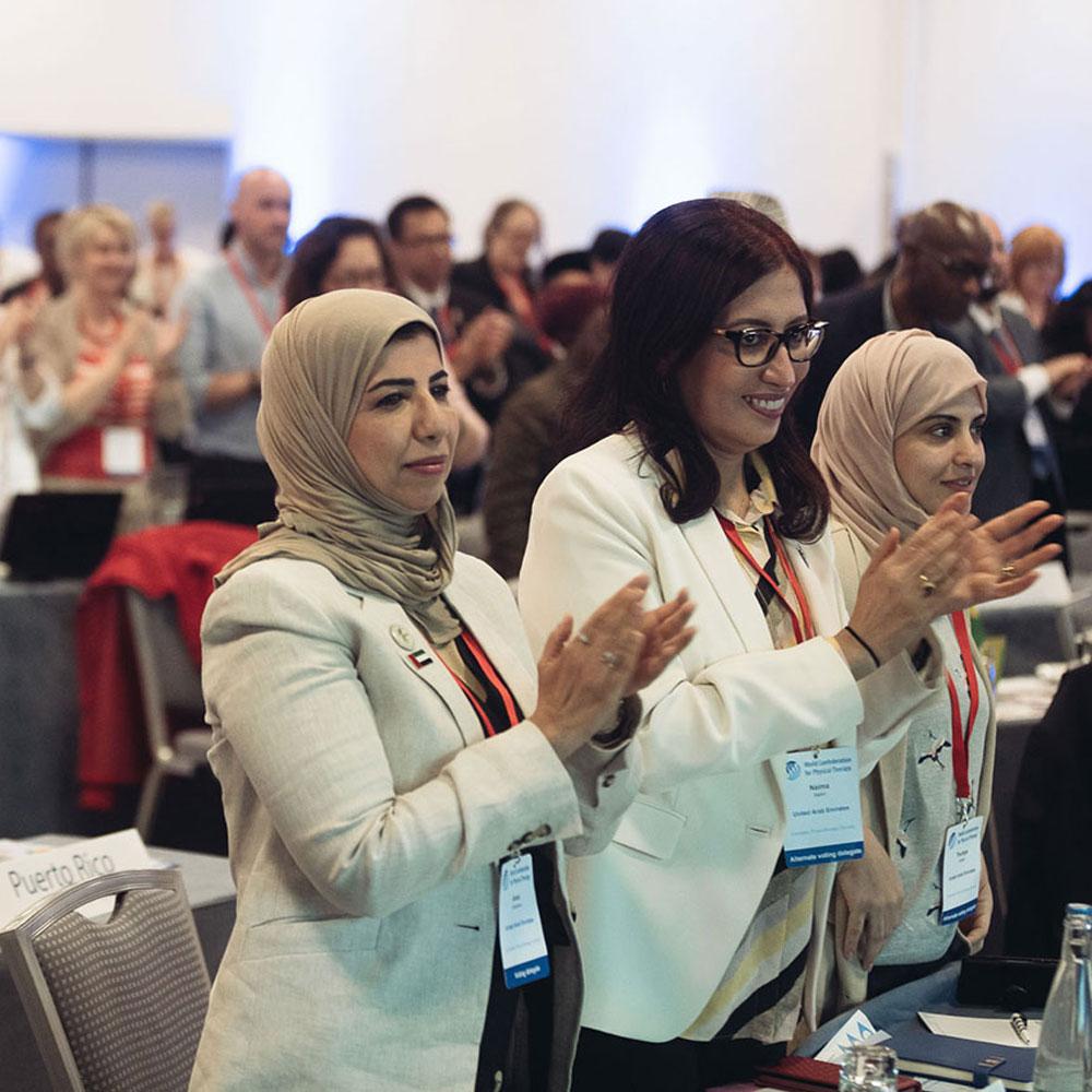 A large crowd applauding