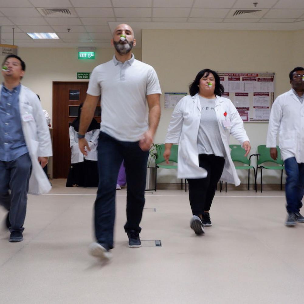 Photograph showing a celebration held in Qatar to mark World PT Day 2019