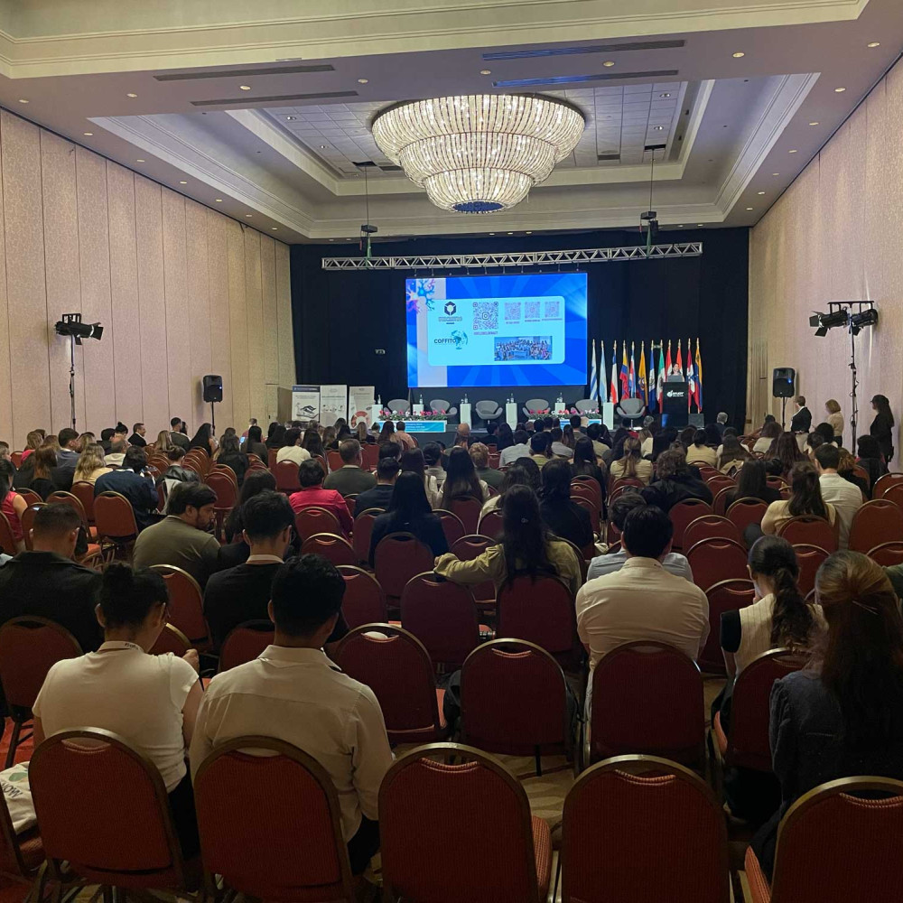 A full conference room from the back of the room