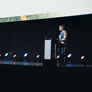 Anne Moseley giving a speech on stage